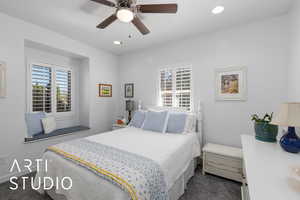 Bedroom with multiple windows, recessed lighting, a ceiling fan, and dark carpet