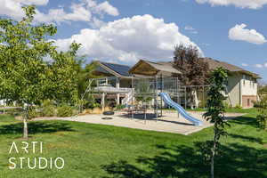 Community jungle gym featuring a lawn