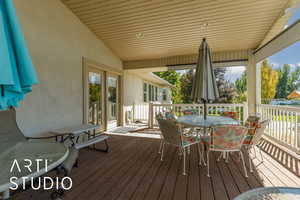 Wooden terrace featuring outdoor dining space