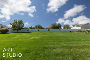View of fenced backyard