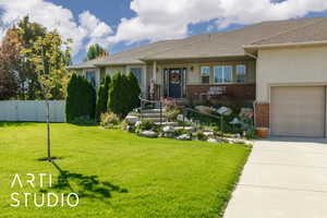 Single story home with brick siding, stucco siding, roof with shingles, and concrete driveway