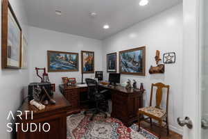 Home office featuring wood finished floors and recessed lighting
