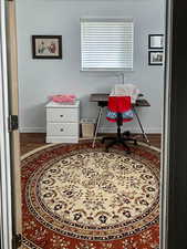 Office area with wood finished floors
