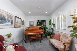 Sitting room featuring carpet floors and recessed lighting