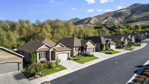 Aerial perspective of suburban area with a mountainous background