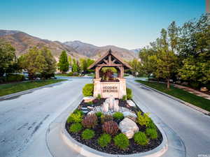 View of asphalt road with a mountain view and curbs