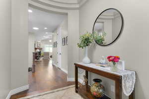 Corridor featuring light tile patterned floors and recessed lighting