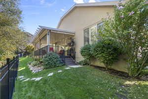 View of side of home with stucco siding
