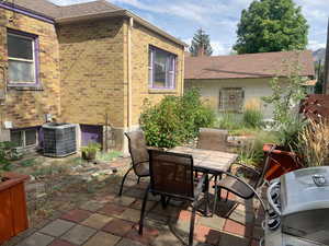 View of patio featuring outdoor dining area and area for grilling