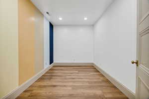 Spare room with light wood-style flooring and recessed lighting