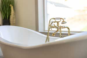 Bathroom view of a freestanding tub and a sink