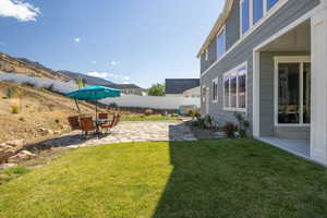 View of yard featuring a patio area and a mountain view