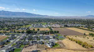 Aerial perspective of suburban area with a mountain backdrop