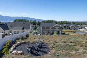 Rear view of house featuring a residential view and a mountain view