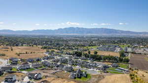Aerial view of residential area featuring a mountain backdrop