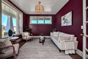 Living room featuring a chandelier and wood finished floors