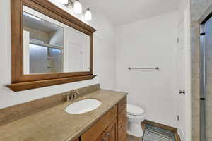 Full bathroom with vanity and a shower with shower door