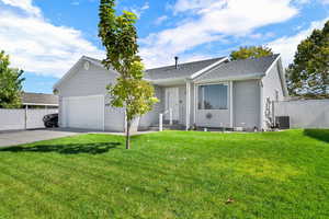 Single story home featuring a shingled roof, concrete driveway, and a garage