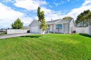Ranch-style house with concrete driveway, an attached garage, and a shingled roof