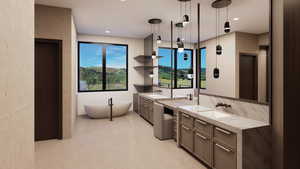 Full bathroom featuring two vanities, a soaking tub, and recessed lighting