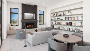 Sitting room with a fireplace and built in shelves
