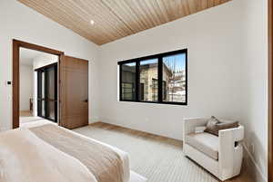 Bedroom featuring wood ceiling, lofted ceiling, and wood finished floors