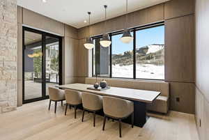Dining space with light wood-style floors and healthy amount of natural light