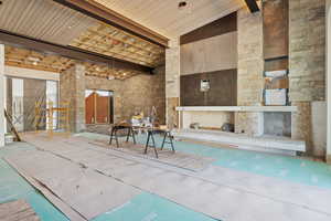 Community lobby with high vaulted ceiling and beamed ceiling