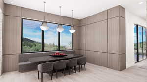 Dining area featuring light wood-style floors and recessed lighting