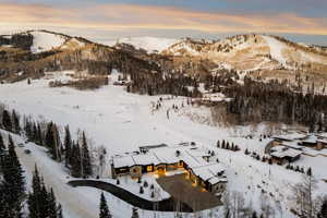 Snowy aerial view featuring a mountain view