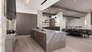 Kitchen with modern cabinets, light wood finished floors, an island with sink, decorative light fixtures, and open floor plan