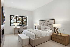 Bedroom featuring a desk, light colored carpet, and recessed lighting