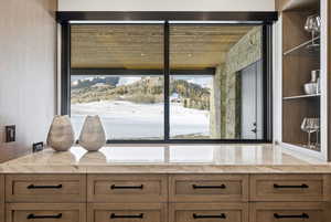 Detailed view of a textured wall and a mountainous background