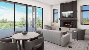Living room featuring a fireplace, healthy amount of natural light, and recessed lighting
