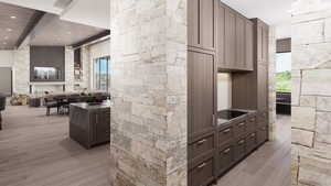 Kitchen with light wood finished floors, beam ceiling, recessed lighting, open floor plan, and dark countertops