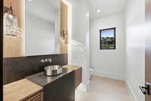 Bathroom featuring vanity and recessed lighting