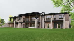 Back of house featuring a lawn, a chimney, a balcony, and a patio