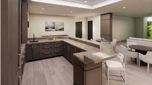 Indoor wet bar with light wood-style floors, recessed lighting, dark brown cabinets, and dark countertops