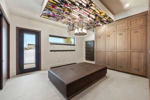 Mudroom with light tile patterned floors