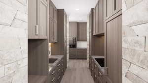 Kitchen with light wood-style flooring, black electric stovetop, recessed lighting, oven, and modern cabinets