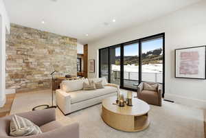 Living area with wood finished floors and recessed lighting