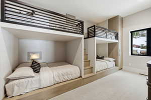 Carpeted bedroom with baseboards