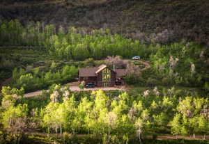 View from above of property featuring a forest