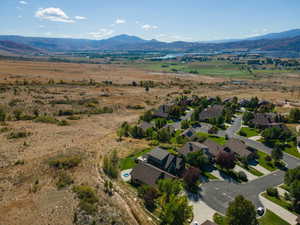 Aerial view of residential area featuring a mountainous background