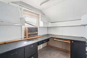 Unfurnished office with lofted ceiling