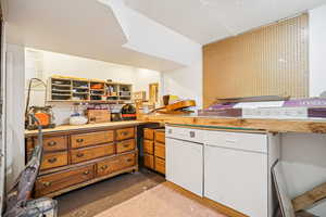 Kitchen featuring concrete floors and a textured ceiling