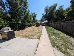 Fenced backyard with a Shed