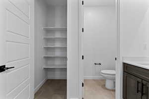 Bathroom featuring vanity and light tile patterned floors