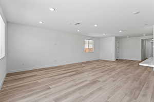 Unfurnished room featuring light wood-type flooring and recessed lighting
