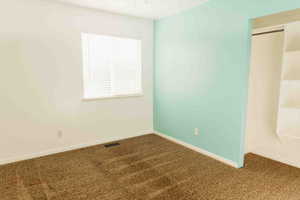 Bedroom 3 featuring carpet flooring and a closet